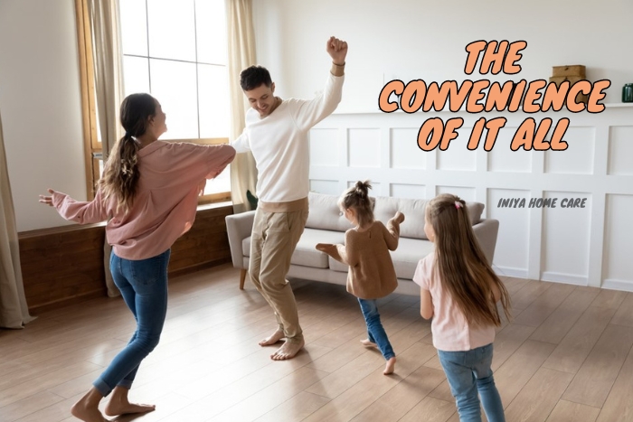 A joyful family dancing together in their Pollachi home, enjoying the freedom and convenience provided by Iniya Home Care's comprehensive home services