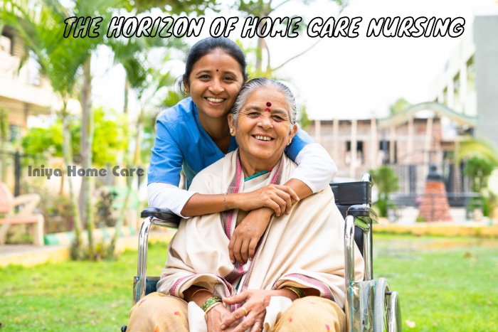 Joyful elderly woman in a wheelchair embraced by a caring Iniya Home Care nurse, reflecting the compassionate spirit of home care nursing in Pollachi