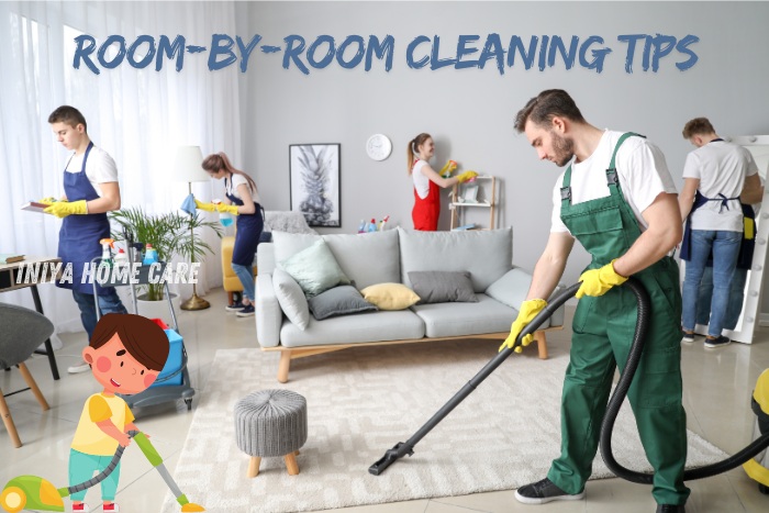 Team of cleaners working efficiently in a living room, demonstrating room-by-room cleaning tips. Iniya Home Care in Pollachi offers expert housekeeping services to keep your home spotless and organized.