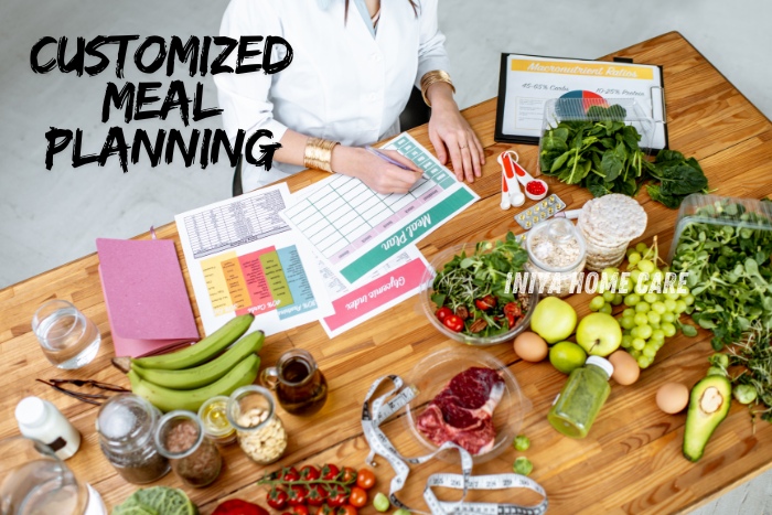 Nutritionist creating customized meal plans with fresh ingredients and charts, representing the personalized meal planning services offered by Iniya Home Care in Pollachi. Ensuring tailored nutrition for optimal health and wellness.