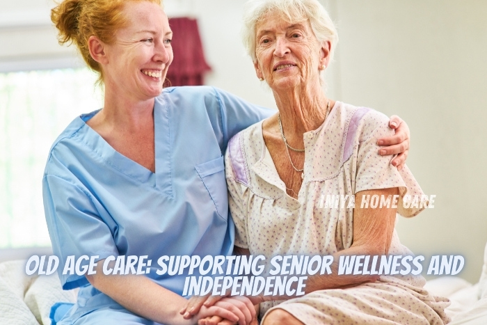 Old age care services by Iniya Home Care in Pollachi. A smiling caregiver supports an elderly woman, highlighting compassionate senior care that promotes wellness and independence. This image reflects the dedication to enhancing the quality of life for seniors through personalized and attentive care