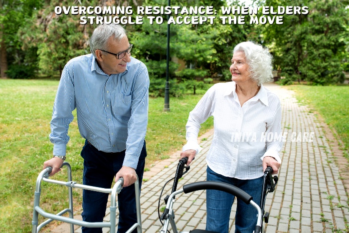 Overcoming resistance in elderly care by Iniya Home Care. An elderly couple using walkers smiles at each other