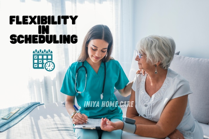 Iniya Home Care in Pollachi, showing a nurse attentively consulting with a senior woman at home