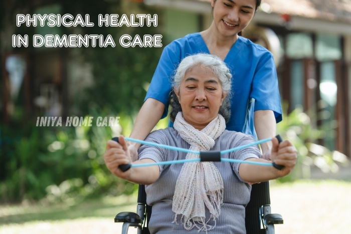 Iniya Home Care in Pollachi assisting an elderly woman in a wheelchair with physical exercises as part of support