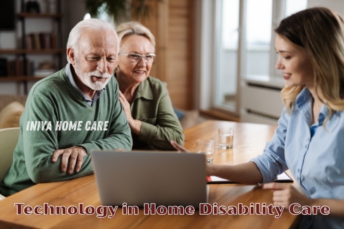 Elderly couple learning about modern technology in home disability care with support from INIYA HOME CARE  in Pollachi