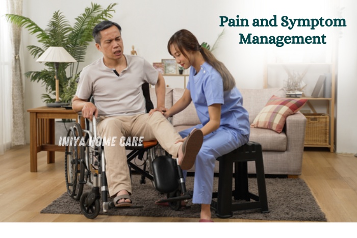 Female caregiver from Iniya Home Care in Pollachi assisting a wheelchair-bound patient with pain and symptom management